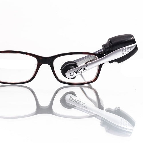 Carbonklean Peeps Cleaner cleaning a pair of glasses