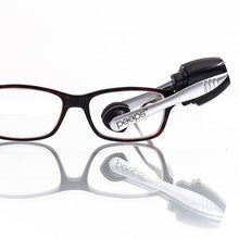 Load image into Gallery viewer, Carbonklean Peeps Cleaner cleaning a pair of glasses
